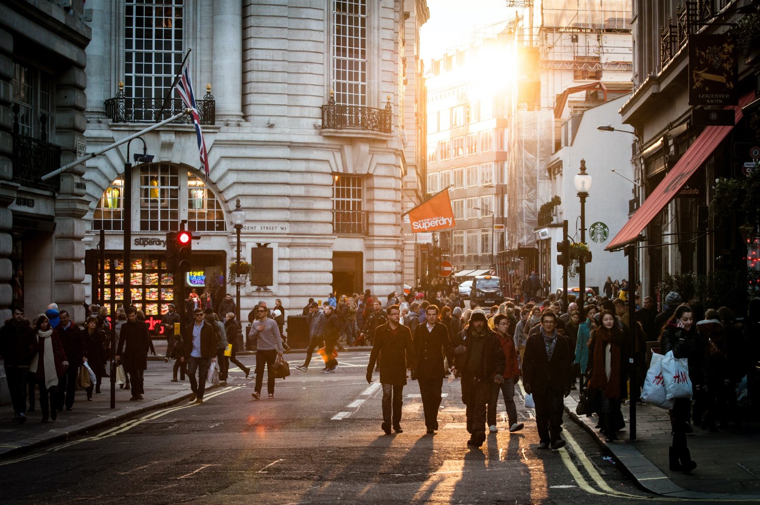 people walking at sunset