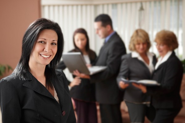 This was a business portrait, but my client wanted more than a simple headshot.  It was taken late in the day meaning I had to create my own light. She wanted her team in the background working, to show when you worked with her, she had a whole team backing her up. I used a Canon 430 EX II to light the background, aiming it off a white wall and the ceiling, out of the frame. I then used a Canon 580 EX II off camera in a Westcott Apollo 28" soft box to light my client.  I ratio'd the lighting so that the background light was at a 2:1 ratio with my main light. EOS 5D Mark II with EF 24-105 f/4L IS. 1/100 @ f/4, ISO 400. 