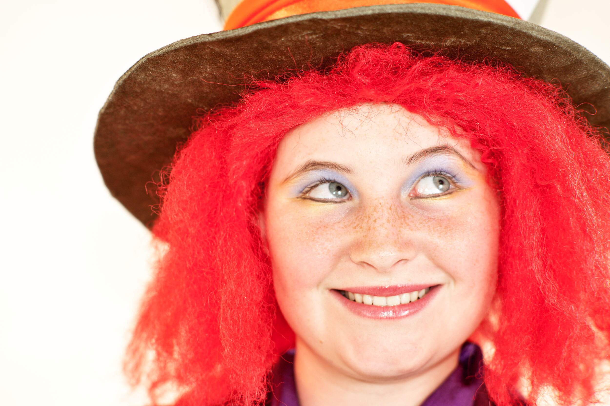 teen girl dressed as the mad hatter front light photography